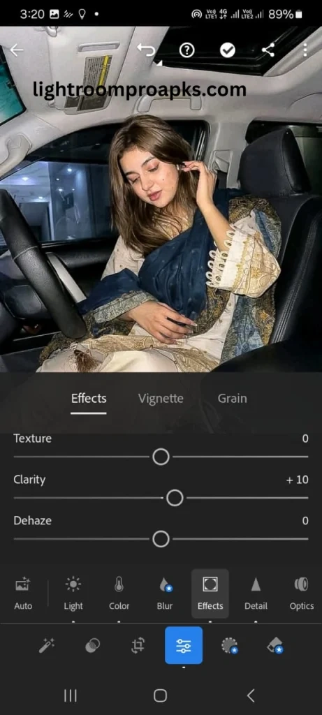 Lightroom mobile screenshot showing effects panel with clarity, texture, and dehaze adjustment sliders applied on a portrait photo.