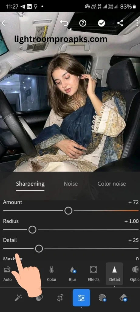 Lightroom mobile screenshot showing sharpening settings with detail slider highlighted by a hand pointer for photo enhancement.