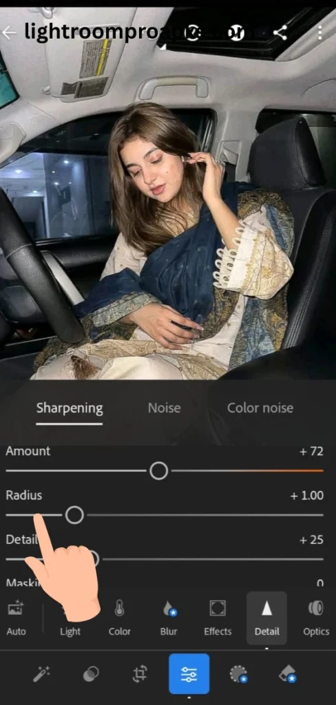 Lightroom mobile screenshot showing sharpening panel with radius slider highlighted by a hand pointer for photo detail enhancement.